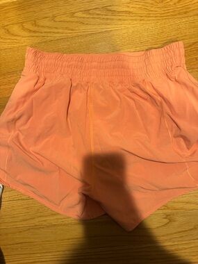 Lululemon light orange running shorts